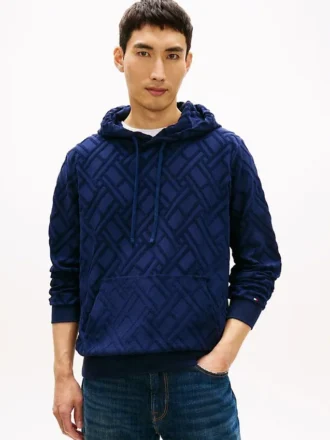 Hoodie i velourjacquard med flagglogo över hela plagget