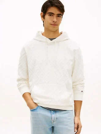 Hoodie i velourjacquard med flagglogo över hela plagget