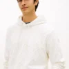 Hoodie i velourjacquard med flagglogo över hela plagget Hoodie i velourjacquard med flagglogo över hela plagget