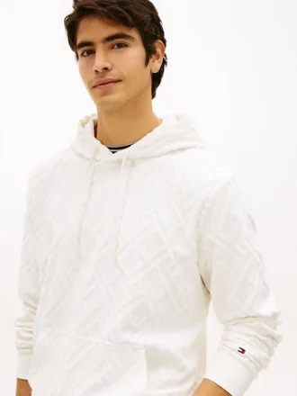 Hoodie i velourjacquard med flagglogo över hela plagget