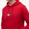 Hoodie med flagglogotyp Hoodie med flagglogotyp