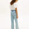 Jeans med påsydda fickor och vid ben för barn