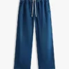 Lättviktiga jeans med vid ben och dragkedja Lättviktiga jeans med vid ben och dragkedja