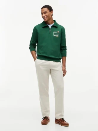 Polo-tröja med blommig logotyp och kvartslång dragkedja