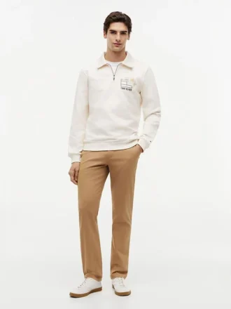 Polo-tröja med blommig logotyp och kvartslång dragkedja
