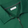 Polo-tröja med blommig logotyp och kvartslång dragkedja Polo-tröja med blommig logotyp och kvartslång dragkedja