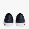 Sneakers i vulkaniserat läder med flaggstripe