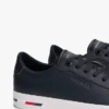 Sneakers i vulkaniserat läder med flaggstripe