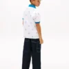 Stretchpolo med nautiskt logo-mönster för barn Stretchpolo med nautiskt logo-mönster för barn