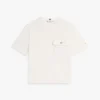 T-shirt med avslappnad passform och ficka med guldknapp