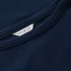 T-shirt med båthalsringning och guldknappar T-shirt med båthalsringning och guldknappar