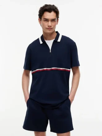Tommy Jeans avslappnad polotröja med kvartslång dragkedja