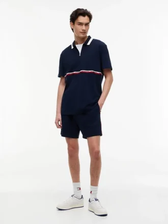 Tommy Jeans avslappnad polotröja med kvartslång dragkedja